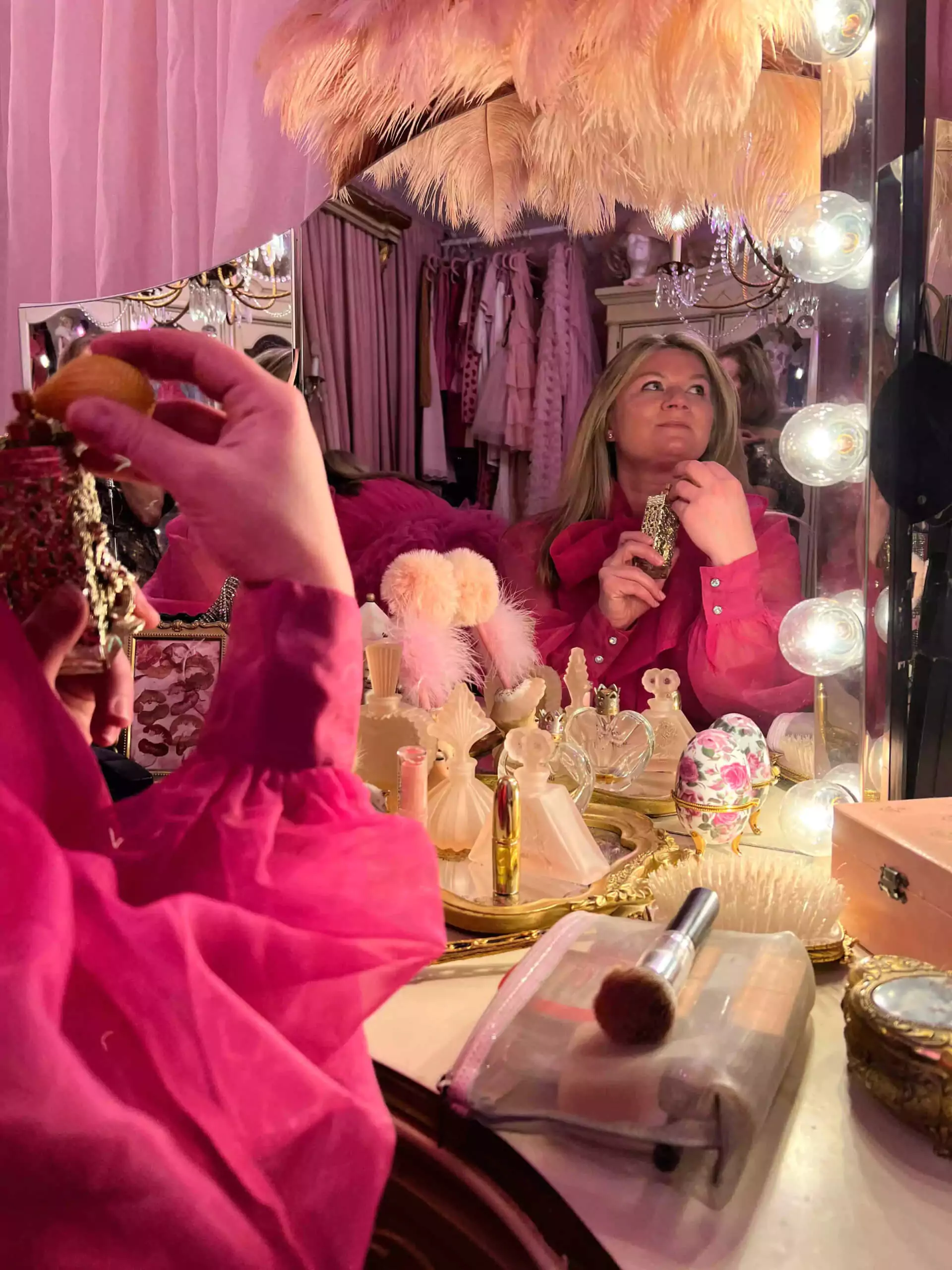 Katie sitting at the beauty vanity