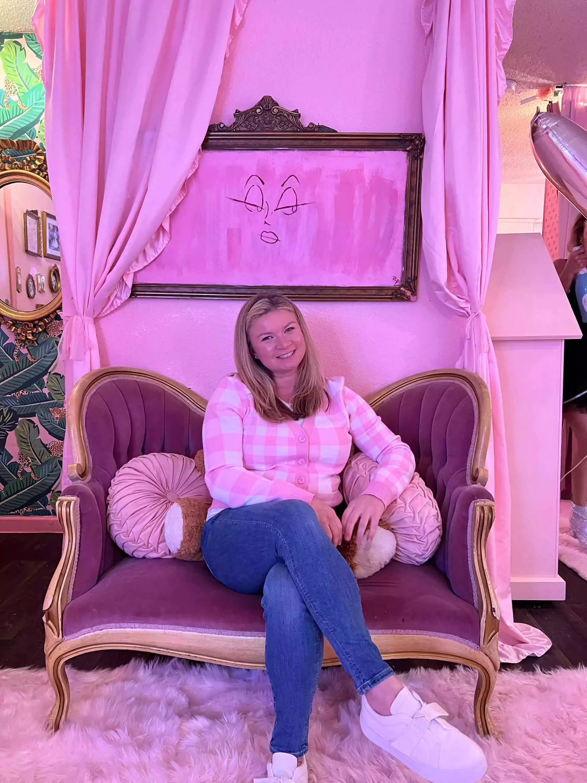 Katie sitting on small anitque sofa