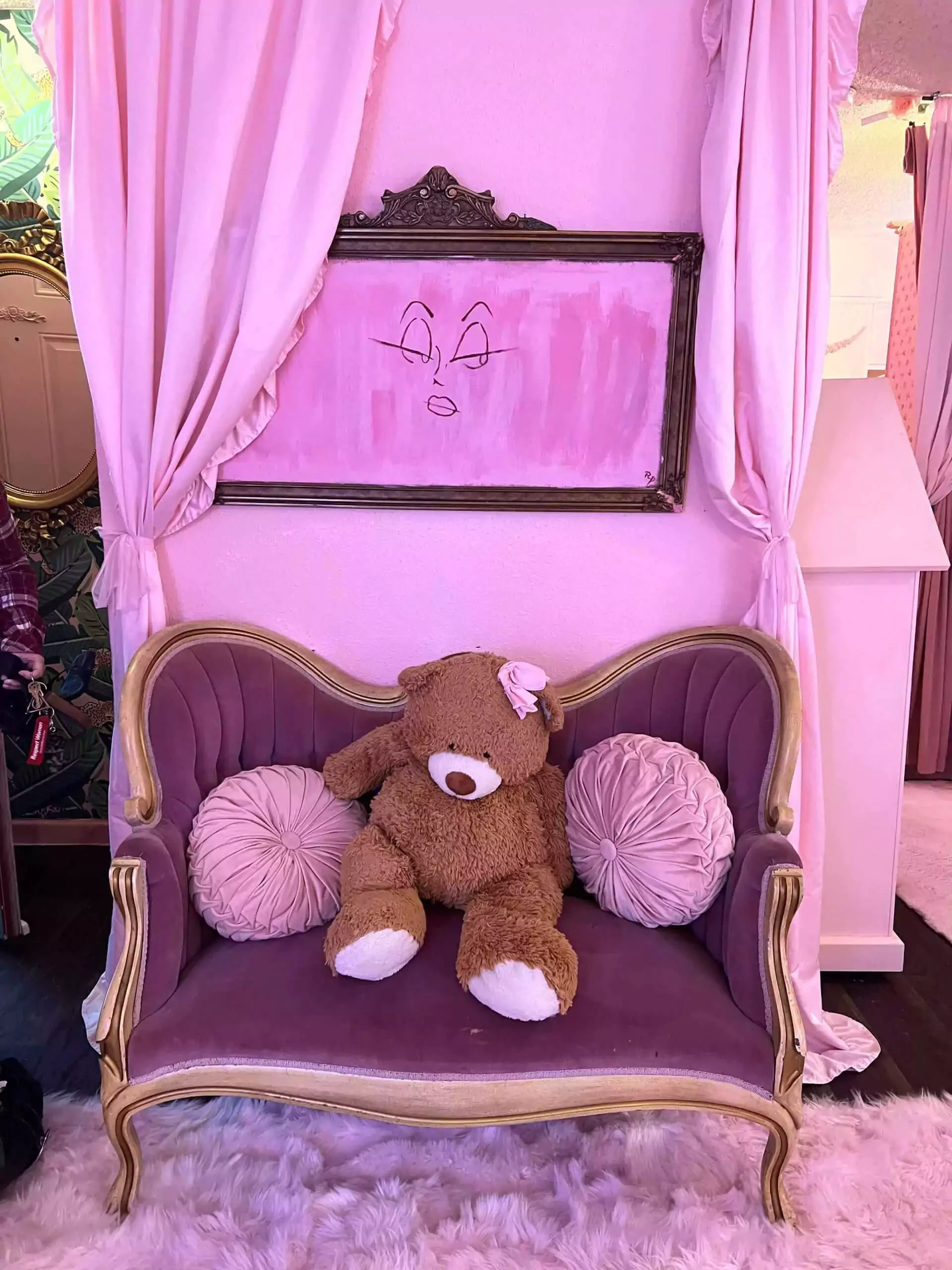 brown bear on small anitque sofa